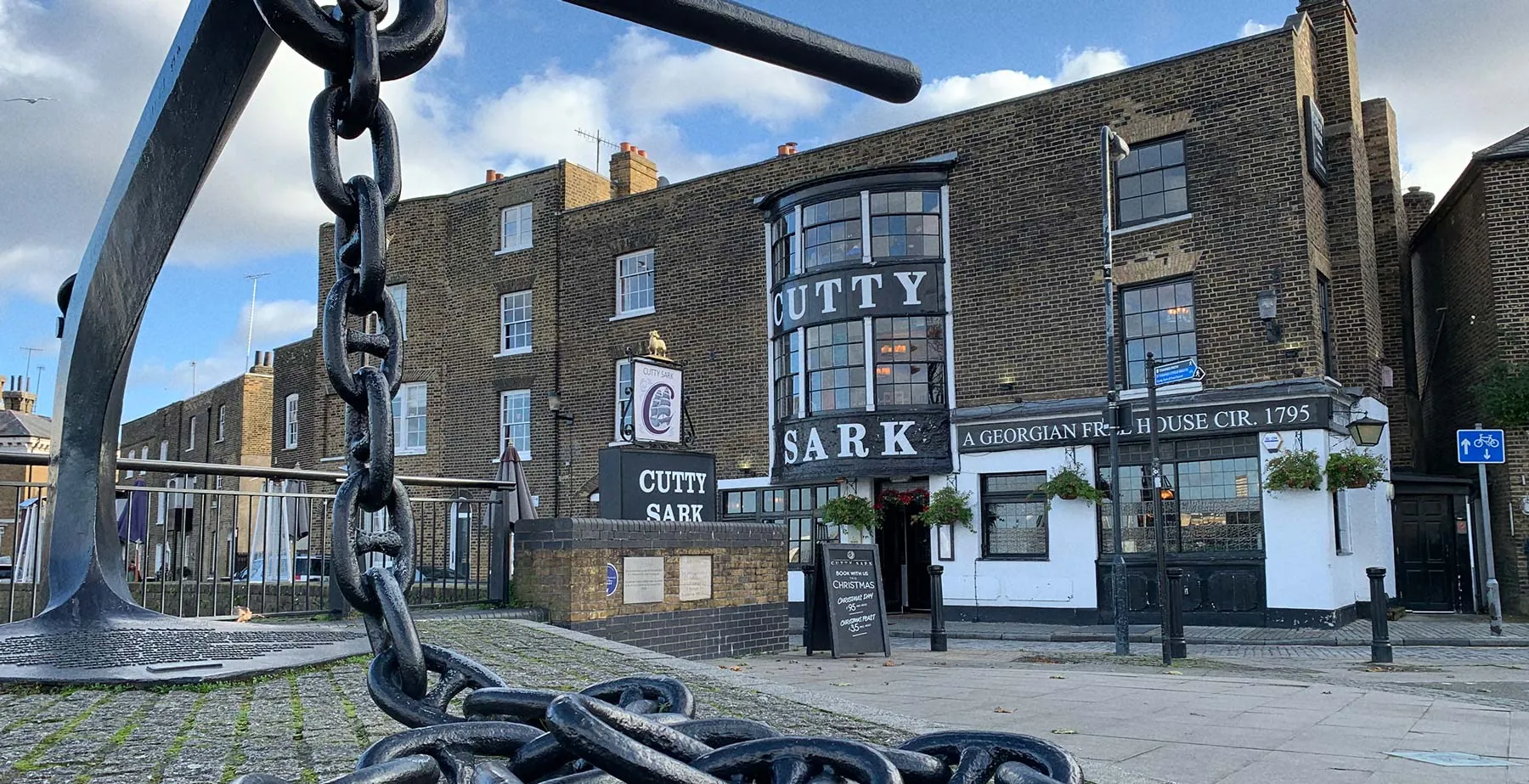 The Cutty Sark pub in Greenwich behind a large anchor chain